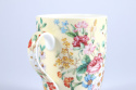 Kubek kremowy z motywem kwiatowym z sitkiem i przykrywką do parzenia herbaty i ziół