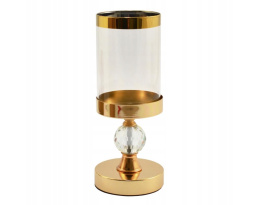 Elegancki złoty świecznik ze szklanym kloszem do sypialni